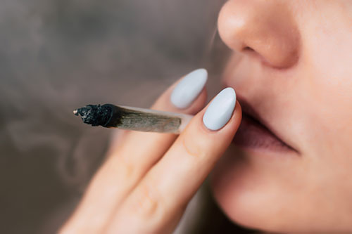 Woman smoking cannabis